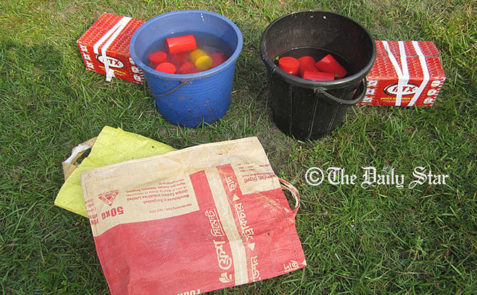 Photo of the handmade crude bombs recovered by Rab from Patuakhali district town late Friday Night.