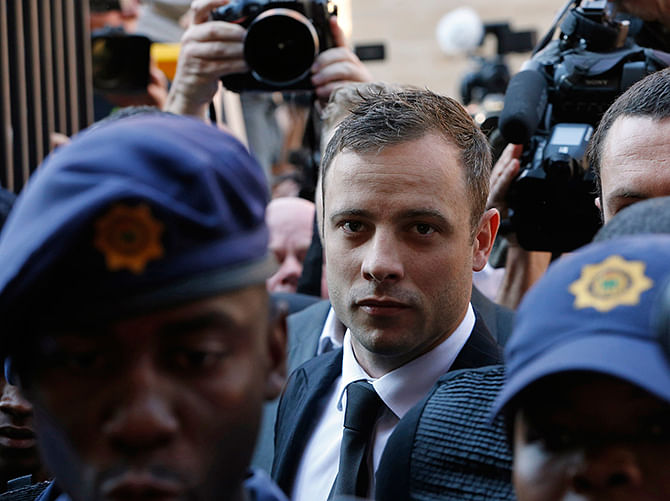 South African Olympic and Paralympic sprinter Oscar Pistorius arrives at the North Gauteng High Court in Pretoria September 12, 2014. Photo: Reuters