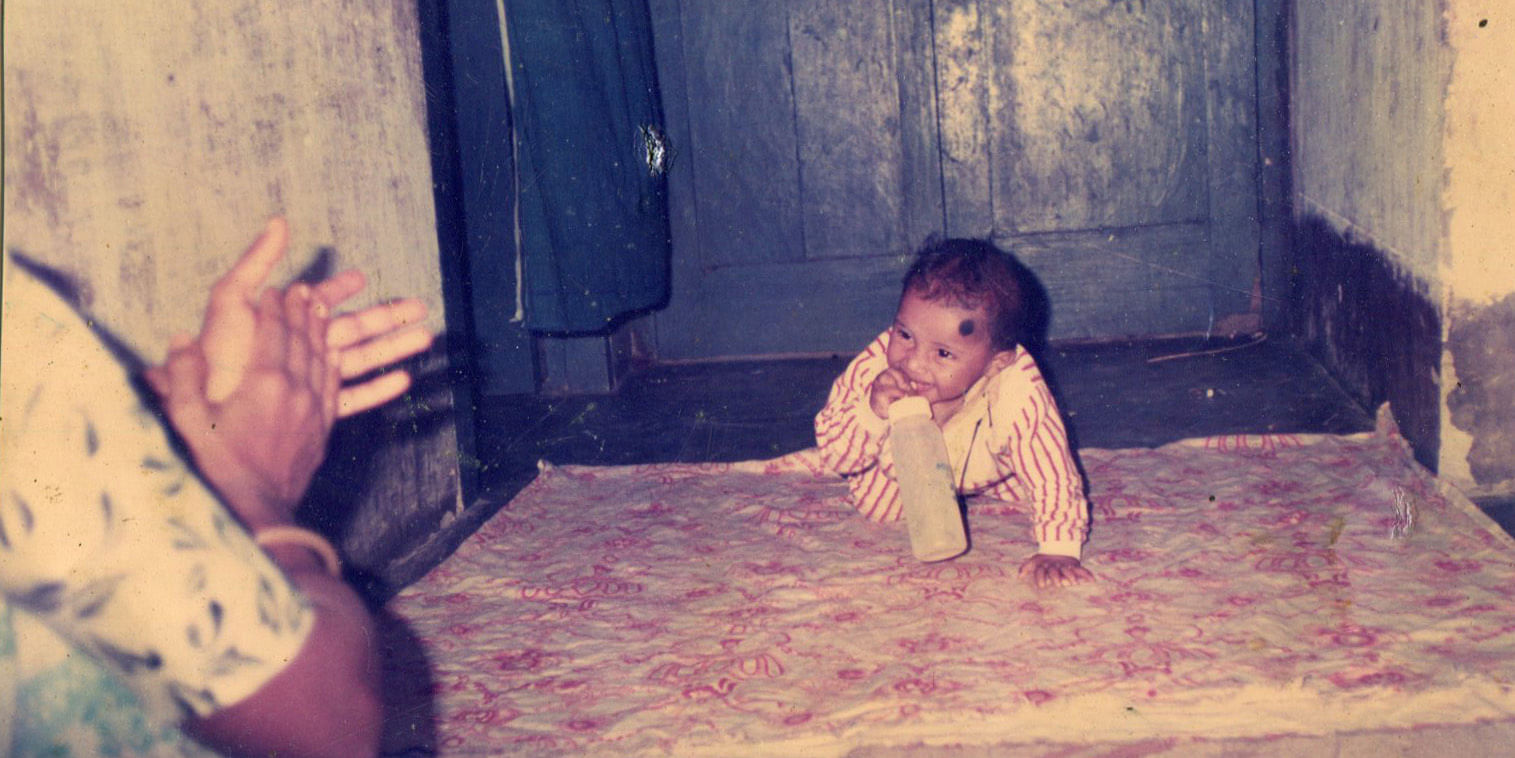 This old photo from the family album shows mother Laily clapping so that her infant son Rajib smiles for the camera. A year and a half later, Rajib died after he was given toxic paracetamol syrup. Photo: Courtesy of Laily Begum.