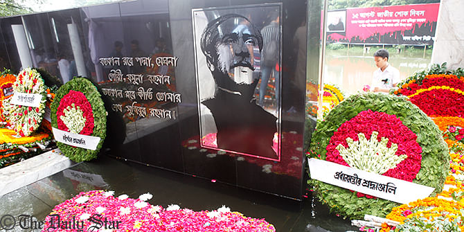 The wreaths are placed by President and Prime Minister at the portrait of Bangabandhu in the Bangabandhu Memorial Museum at Dhanmondi of Dhaka on Friday to mark the National Mourning Day. Photo: Rashed Suman