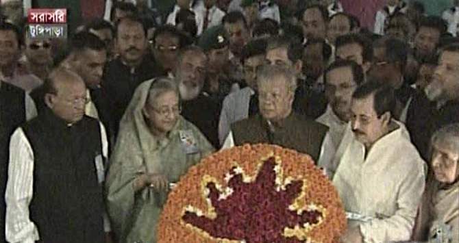 Prime Minister Sheikh Hasina, also the president of Awami League, place wreath at the grave of Father of the Nation Bangabandhu Sheikh Mujibur Rahman on behalf of the party in Tungipara of Gopalganj Monday. Photo: TV grab
