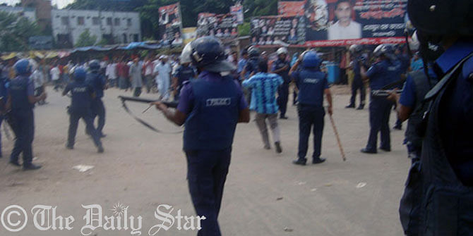 Police charge truncheons, fire teargas canisters on people who try to lay siege to Titas gas office in Manikganj town Tuesday morning. Photo: Star