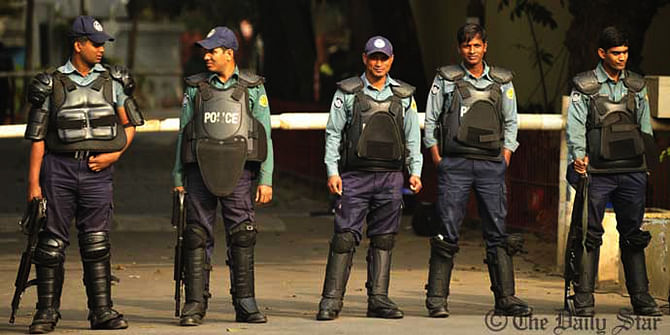 This Star file photo shows additional policemen stand guard in Nayapaltan of Dhaka to avoid any untoward incident. 