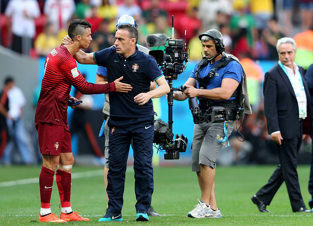 Head coach Paulo Bento of Portugal consoles Cristiano Ronaldo after the 2014 FIFA World Cup Brazil Group G match between Portugal and Ghana at Estadio Nacional on June 26, 2014 in Brasilia, Brazil. Photo: Getty Images