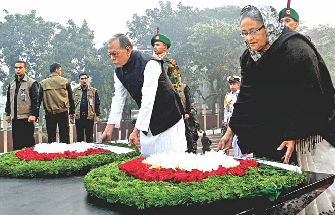 This Star file photo shows President Abdul Hamid and Prime Minister Sheikh Hasina placing wreaths at the Mirpur memorial in Dhaka on Martyred Intellectual Day on December 14, 2013. 