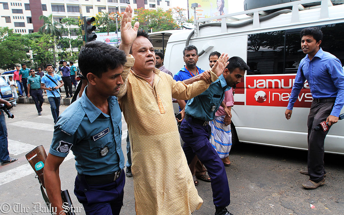 The law enforcers pick up a pro-BNP lawyer for his attempt to enter the High Court premises defying police obstruction. Photo: Palash Khan