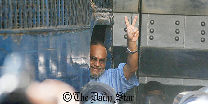 Jamaat-e-Islami leader Mir Quasem Ali shows V-sign on Sunday from a prison van after International Crimes Tribunal-2 awards him death penalty for crimes against humanity that he committed during the country's Liberation War in 1971. Photo: Palash Khan 
