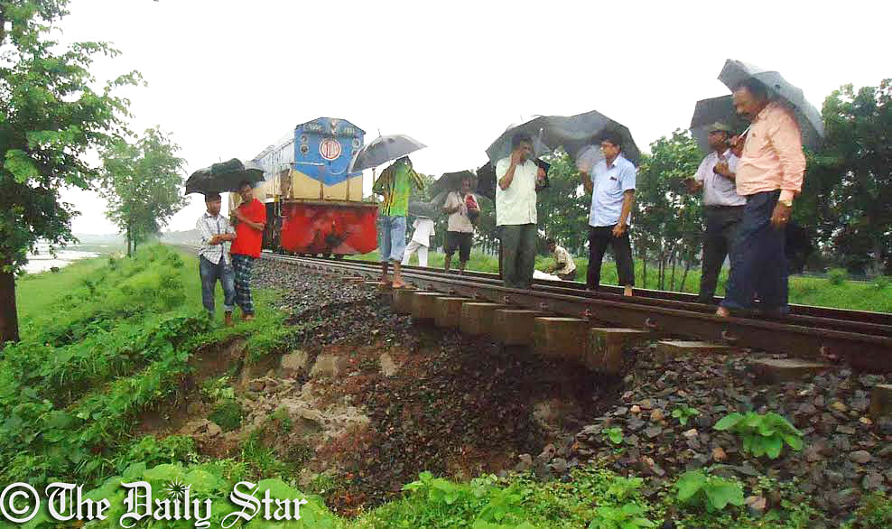 The incessant rain washes away soil under the railway tracks at Analiabari area of Tangail, on the east bank of the Jamuna river, halting the rail communication for around five hours since Saturday morning. Photo: Star