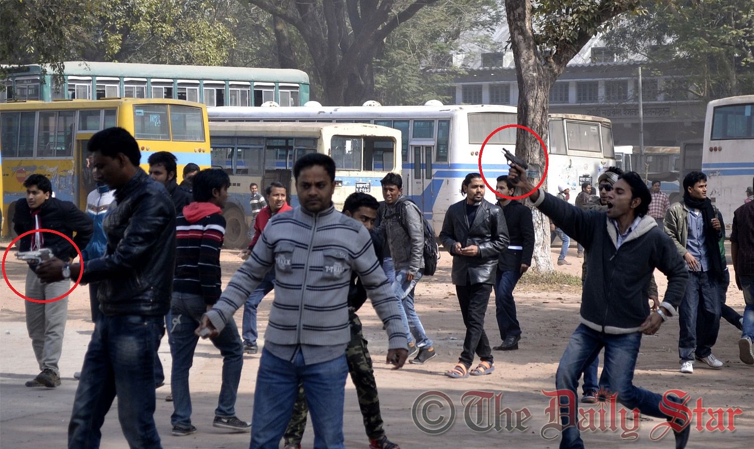 Alleged Bangladesh Chhatra League activists, armed with guns (red-circle marked), wield weapons while chasing the demonstrating students of Rajshahi University on Sunday. Photo: STAR 