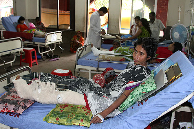 This Star file photo shows a victim of Savar Rapa Plaza collapse on April 24, 2013 lies on a bed in hospital.