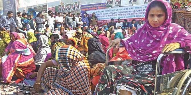 This December 24 photo shows victims of Rana Plaza collapse and their relatives demonstrating for compensation at the disaster site in Savar. Star file photo 