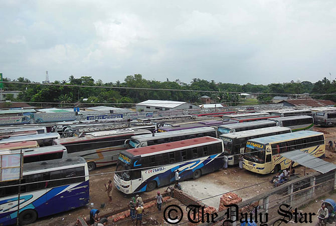 Coaches remain stopped at Dhaka bus stand in Kamarpara area of Rangpur city on Monday due to an indefinite strike. Transport workers enforce the strike in eight districts of Rangpur division. Photo: STAR