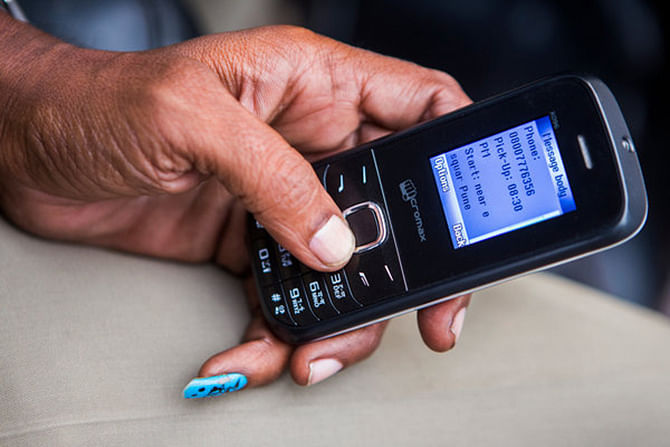 Dusane receiving a text message with details of a pickup. Photo: The New York Times