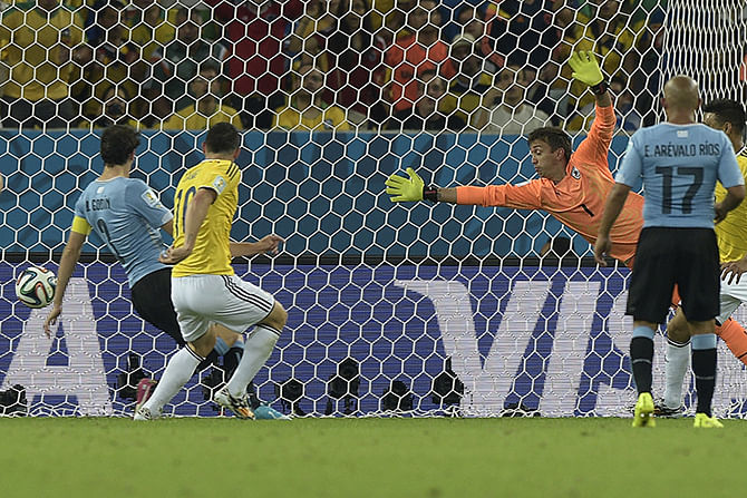 Colombia's Colombia's midfielder James Rodriguez (2nd L) scores his second goal against Uruguay during a Round of 16 football match at the Maracana Stadium in Rio de Janeiro during the 2014 FIFA World Cup on June 28, 2014. Photo: Getty Images