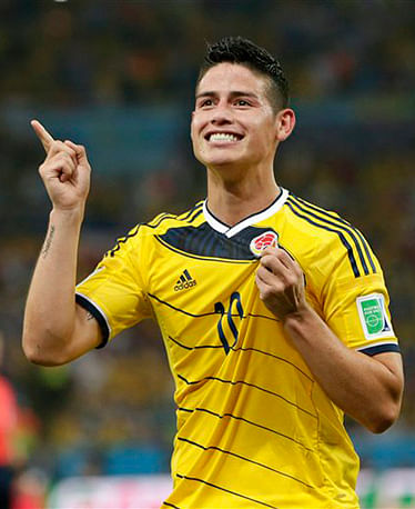 In this June 28, 2014, file photo, Colombia's James Rodriguez celebrates after he scored his side's second goal during the World Cup round of 16 soccer match between Colombia and Uruguay at the Maracana Stadium in Rio de Janeiro, Brazil. Photo: AP