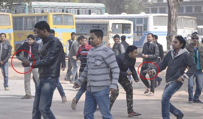 This February 2 photo shows Bangladesh Chhatra League cadres wielding with handguns attack the students demonstrating against fee hike and evening shift on Rajshahi University campus.