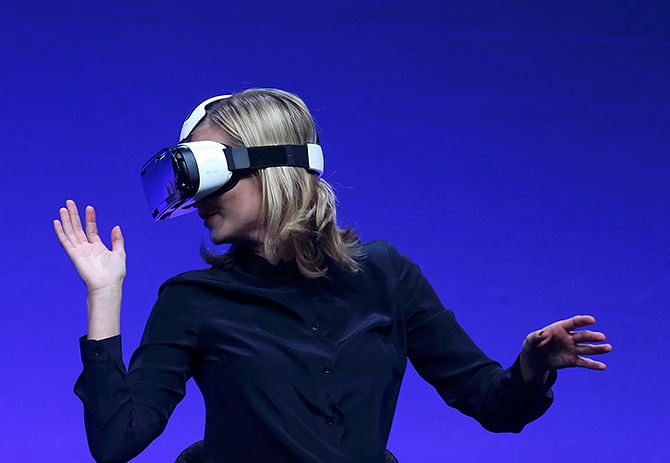 Television presenter Rachel Riley tries the new Samsung Gear VR device at the Unpacked 2014 Episode 2 event ahead of the IFA Electronics show in Berlin, September 3, 2014. Photo: Reuters