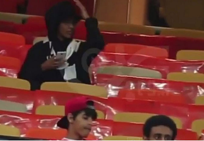 Video footage purporting to show the woman sat in the away stand was posted to YouTube. Photo taken from The Independent