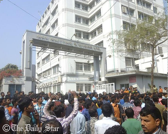 Aggrieved factory workers stage demonstration in front of AKH Knitting and Dyeing Ltd at Savar, on the outskirts area of the capital, as 50 of their fellow workers fall sick for unknown reason Sunday. Photo: STAR