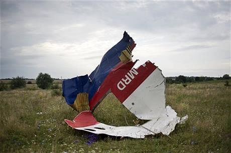 A piece of the crashed Malaysia Airlines Flight 17 lies in the grass near the village of Hrabove, eastern Ukraine, Saturday, July 19. Photo: AP
