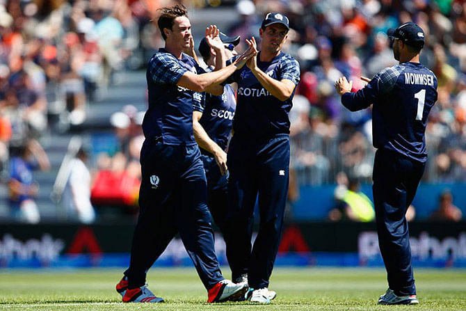 Scotland's Iain Wardlaw celebrates after claiming a New Zealand wicket during the sixth World Cup 2015 match at Dunedin on February 17, 2015. Photo: ICC