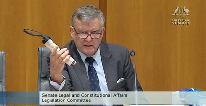 Liberal Senator Bill Heffernan shows a  'pipe bomb' into Parliament during a Senate Committee meeting to highlight flaws in the security arrangements at Parliament House in Canberra. Photo: Mail Online