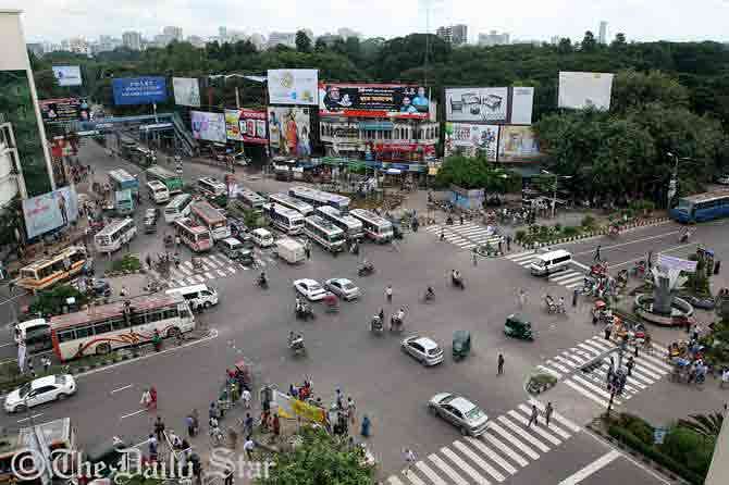 The aerial view shows few vehicles at Shahbagh intersection in Dhaka on Sunday's office rush hours during eight-hour hartal (shutdown) enforced by Islami Chhatra Sena across the country. The roads at the intersection usually remain too busy in other working days. Photo: Palash Khan