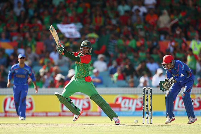 Bangladesh's Shakib Al Hasan hammers a delivery to the boundary ropes against Afghanistan in the ICC Cricket World Cup match at Canberra. Photo: ICC