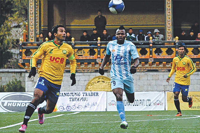 Sheikh Jamal skipper Nasiruddin Chowdhury (L) tries to win the ball during their King's Cup semifinal match against Manang Marshyangdi Club at the Changlimithang Stadium in Thimphu on November 29. PHOTO: COURTESY