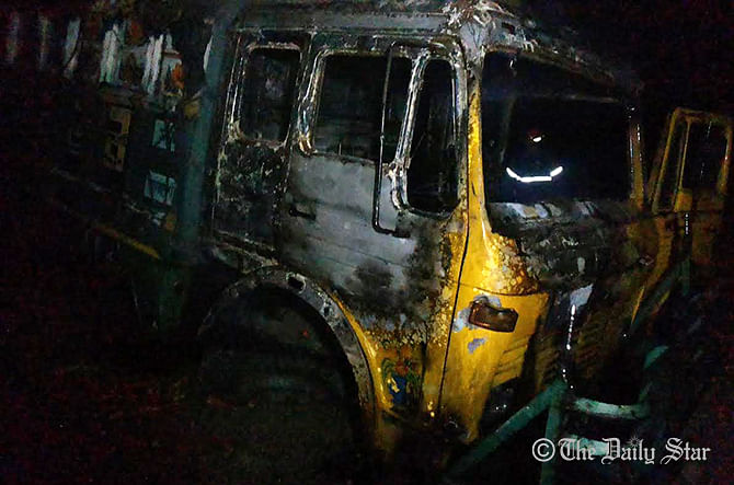 Pro-blockade activists set fire to the truck on Dhaka-Sirajganj in Sirajganj highway early Friday on the 11the day of BNP-led 20-party blockade. Photo: Star  