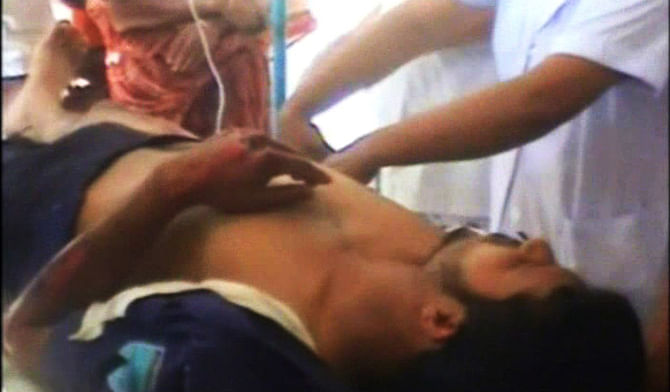 An injured police constable undergoes treatment at Sirajganj General Hospital on Sunday. Photo: TV grab