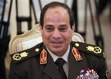 Egypt’s military chief Field Marshal Abdel-Fattah el-Sissi smiles as he speaks to Foreign Minister Sergey Lavrov during their talks along with Egyptian Foreign Minister Nabil Fahmy and Russian Defense Minister Sergei Shoigu in Moscow, Russia, Thursday, Feb 13, 2014. El-Sissi visits Russia on his first trip abroad since ousting the Islamist president, part of a shift to reduce reliance on the United States at a time of frictions between the longtime allies. Photo: AP