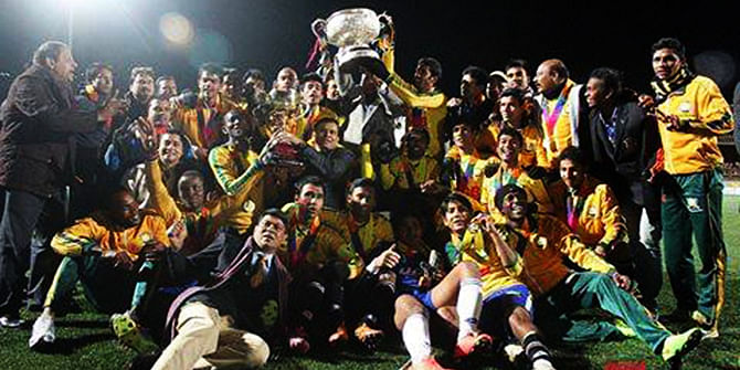 Players and officials of Sheikh Jamal Dhanmondi Club celebrate with the trophy after becoming King’s Club champions Tuesday. Photo: Sheikh Jamal Dhanmondi Club facebook