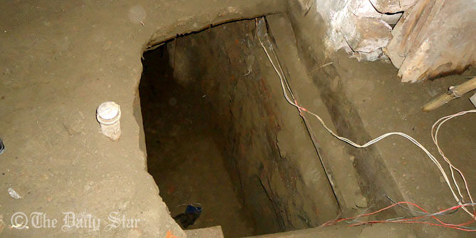 This January 26 photo shows the tunnel through which burglers looted Tk 16.40 crore from the vault of Sonali Bank's Kishoreganj main branch. Star file photo