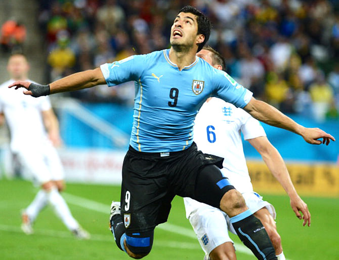Luis Suarez of Uruguay challenges during the 2014 FIFA World Cup Group D match between Uruguay and England at Arena de Sao Paulo Stadium in Sao Paulo, Brazil on June 19, 2014. Photo: Getty Images