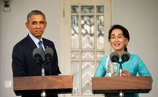 US President Barack Obama and opposition politician Aung San Suu Kyi hold a press conference after their meeting at her residence in Yangon, November 14, 2014. Photo: Reuters