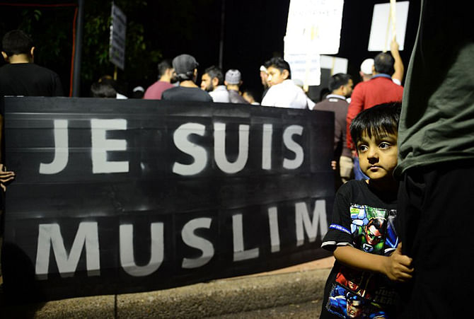 People gather during a rally to protest against negative coverage of Islam and French satirical weekly Charlie Hebdo's caricatures of the Prophet Mohammed, in Sydney on January 23, 2015. Photo: AFP