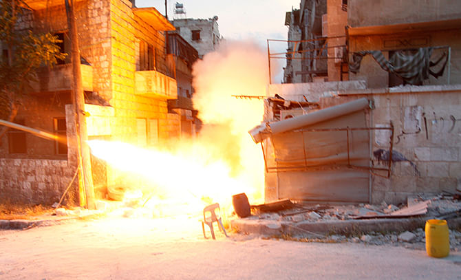 Islamist fighters fire a rocket towards forces loyal to Syria's President Bashar al-Assad in the Seif El Dawla neighbourhood in Aleppo on Thursday. Photo: Reuters
