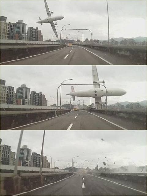 Rescuers pull a passenger out of the TransAsia Airways plane which crash landed in a river, in New Taipei City, February 4, 2015. Photo: Reuters