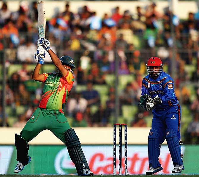 Bangladesh opener tamim Iqbal hits a boundary to his way to 21 in his comeback match after a neck injury against Afghanistan at Mirpur Sunday. Photo: ICC