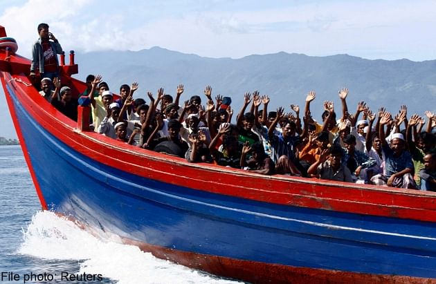 Ethnic Rohingya refugees from Myanmar wave. Thailand has long been a hub for people trafficking, with thousands of Rohingya boat people from neighbouring Myanmar believed to have passed through the kingdom in recent years. Photo: Reuters 