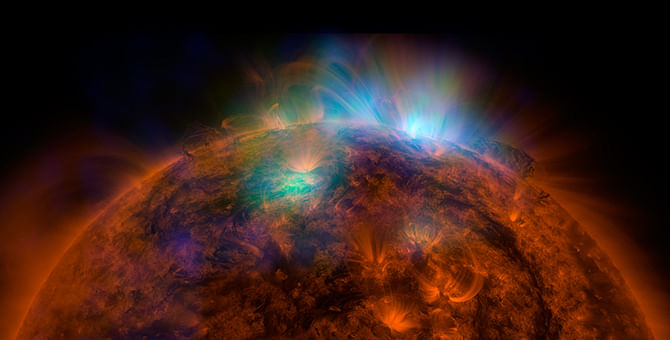 X-rays stream off the sun in this image combining data from NASA's Nuclear Spectroscopic Telescope Array (NuSTAR) space telescope, overlaid on a photo taken by NASA's Solar Dynamics Observatory (SDO).
