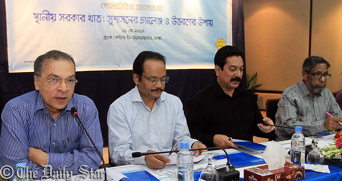 Executive Director of Transparency International, Bangladesh (TIB) Iftekharuzzaman (left) speaks at a discussion on “Local government sector: challenges of good governance and ways out” at the city’s Brac Centre Inn. Photo: Palash Khan