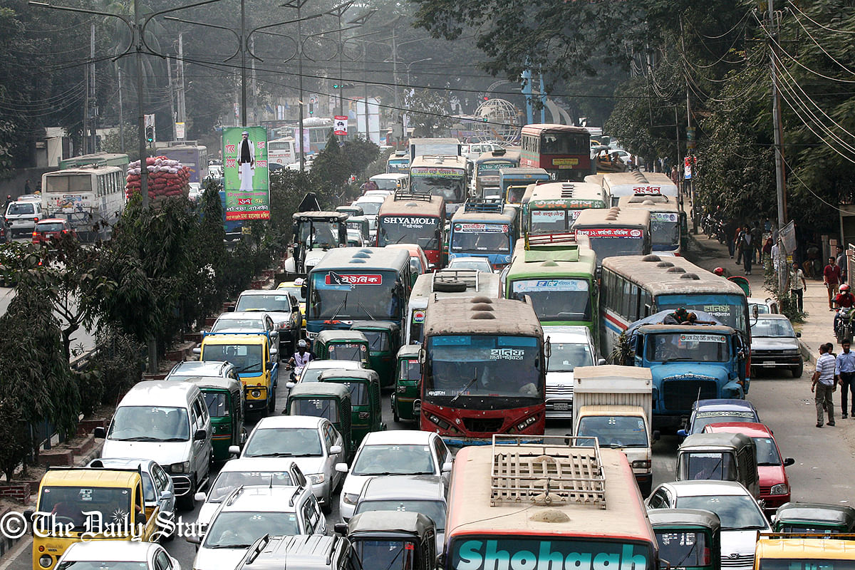 Vehicles stand in a long queue on a street at Kakrain in Dhaka on Saturday, January 3, 2015. Photo: Palash Khan