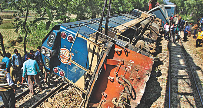 This February 2 photo shows workers trying to repair damaged tracks and salvage a derailed train after rail communications between Chittagong and the rest of the country got snapped due to sabotage by suspected pickets in Mirsarai of Chittagong. Photo: STAR