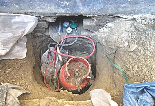This March 8 photo shows the tunnel that led to the vault of Sonali Bank Adamdighi branch in Bogra from where Tk 30.8 lakh was looted yesterday.