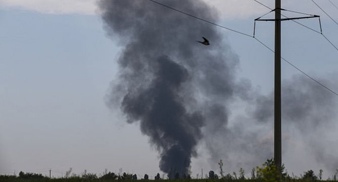 Helicopter crash scene Black smoke was seen rising from the scene of the crash. Photo: AP