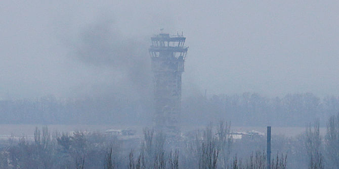 Smoke rises near the traffic control tower of the Sergey Prokofiev International Airport damaged by shelling during fighting between pro-Russian separatists and Ukrainian government forces, in Donetsk, eastern Ukraine, November 12, 2014. Photo: Reuters