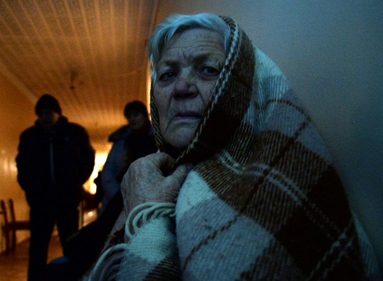1.	An elderly woman sits in hospital corridor following heavy shelling in the eastern Donetsk region of the Ukraine on February 11, 2015. Photo: AFP