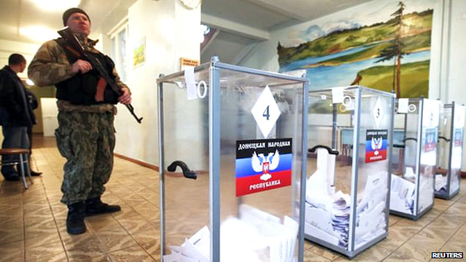 Armed fighters were seen at polling stations across the two rebel regions. Photo: Reuters